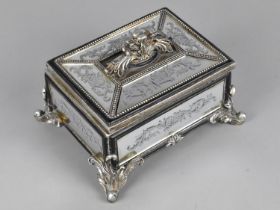 A Mid 20th Century Mirrored Rectangular Casket with Scrolled Feet, 17cms Wide