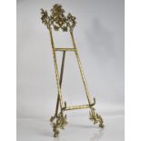 A Tall Reproduction French Style Table Top Brass Picture Easel with Foliate and Figural