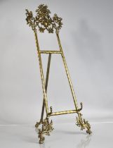 A Tall Reproduction French Style Table Top Brass Picture Easel with Foliate and Figural