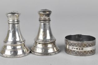 A Pair of Silver Salt and Pepper Shakers Together with a Silver Napkin Ring