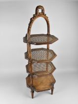 A Four Tier Cake Stand with Three Cane Shelves and Base Carved Shelf, Carved Carrying Handle,