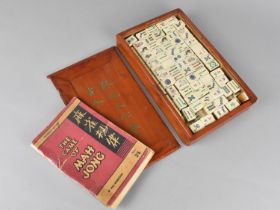 A Cased Bone and Bamboo Mahjong Set with Fifteenth Edition 'The Game of Mahjong' Booklet by Max