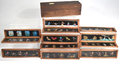 A Vintage Wooden Box with Sliding Lid Containing Coloured Magic Lantern Strip Slides, 26cm Long