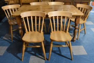 A Modern Rectangular Pine Kitchen Table and Six Chairs, 151x90cms