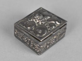 A Small White Metal Box with Repousse Decoration Having Fruit to Lid, 2.5cm Square