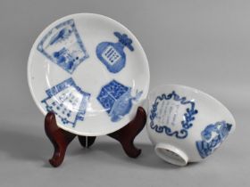 An Oriental Porcelain Blue and White Tea Bowl and Saucer Decorated with Script Verse and Precious
