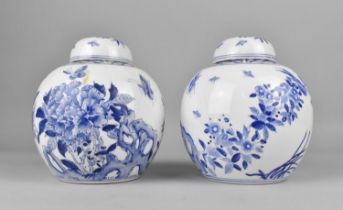 A Pair of Blue and White Ginger Jars Decorated with Blossoming Branches, Birds and Butterflies,