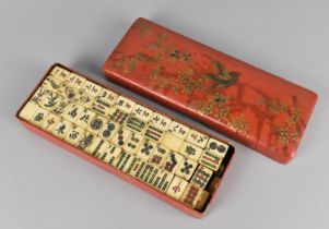 An Early/Mid 20th Century Chinese Mahjong Game, The Bone and Wood Tiles Housed in a Lacquered