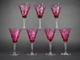 A Set of Seven Cut Cranberry Glass Large Wine Glasses