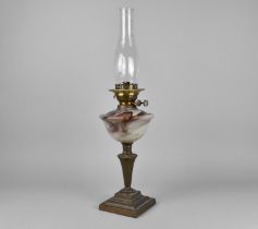 A Late Victorian/Edwardian Oil Lamp with Opaque Glass Reservoir and Plain Glass Chimney, 61cms High