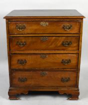 An Edwardian Walnut Chest of Small Proportions Having Four Graduated Long Drawers and Ogee Bracket