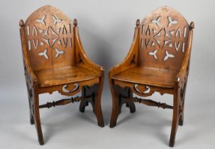 A Pair of Late Victorian Gothic Revival Oak Side Chairs with Pierced Backs