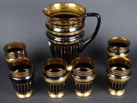 An Amber Glass and Gilt Decorated Lemonade Set for Six