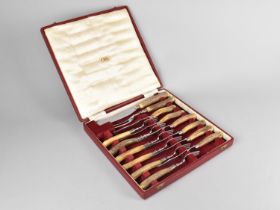A Canteen of Six Bone Handled Knives and Forks together with Matching Carvers by WR Humphreys and Co