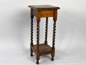 A Mid 20th Century Oak Square Topped Jardiniere Stand with Barley Twist Supports, 70.5cms High