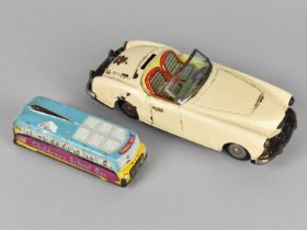 A Vintage Tinplate Friction Driven Sports Car Toy together with a Tinplate Childrens School Bus