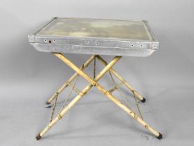 A Vintage Folding Metal Table with Printed Top