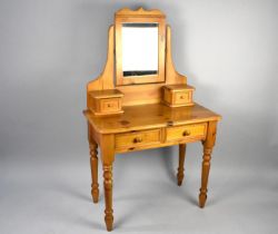 A Modern Pine Two Drawer Dressing Table with Swing Mirror Back and Two Raised Jewel Drawers, 87cms