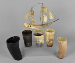 A Collection of Various Horn Goblets together with a Two Masted Model of a Sailing Ship