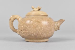A Chinese Qing Period Crackle Glazed Teapot, the Body with Prunus Branch Blossom Decoration in