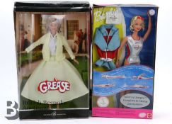 Two Boxed Barbie Dolls