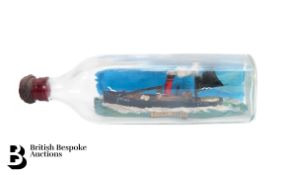Three Men in a Boat and a Ship in a Bottle