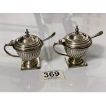 A PAIR OF WHITE METAL FLUTED CONDIMENTS AND TWO SPOONS, STAMPED R&CO, 168 GRAMS.