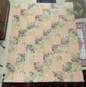 A VINTAGE FLORAL AND STRIPED PATTERN PATCHWORK QUILT, MADE IN INDIA.