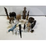 A QUANTITY OF CARVED WOODEN ELEPHANTS AND OTHERS, PLUS A WOODEN BUST AND FIGURE.