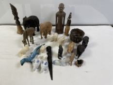 A QUANTITY OF CARVED WOODEN ELEPHANTS AND OTHERS, PLUS A WOODEN BUST AND FIGURE.