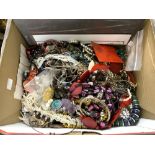 A BOX OF COSTUME JEWELLERY.