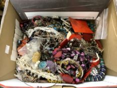 A BOX OF COSTUME JEWELLERY.