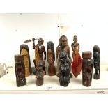 THREE CARVED WOODEN TRIBAL FIGURES, AND SEVEN FIGURES, 33CMS TALLEST.