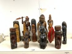 THREE CARVED WOODEN TRIBAL FIGURES, AND SEVEN FIGURES, 33CMS TALLEST.