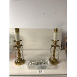 A PAIR OF GILT METAL LUSTRES WITH GLASS DROPS, CONVERTED FOR ELECTRICITY. 18CMS.