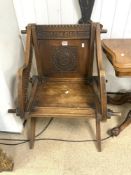 A CARVED OAK WAINSCOT CHAIR.