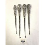 FOUR VICTORIAN HALLMARKED SILVER EMBOSSED BOOT HOOKS WITH DECORATIVE HANDLES LARGEST 27CM