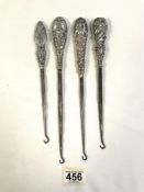 FOUR VICTORIAN HALLMARKED SILVER EMBOSSED BOOT HOOKS WITH DECORATIVE HANDLES LARGEST 27CM
