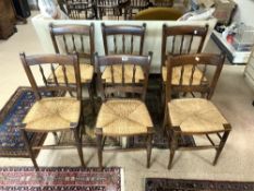 A SET OF SIX RUSH SEATED SPINDLE BACK COUNTRY KITCHEN CHAIRS.