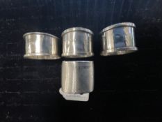 FOUR HALLMARKED SILVER NAPKIN RINGS INCLUDES ONE PAIR BY I S GREENBERG & CO