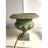 A SMALL CAST IRON GREEN PAINTED FLUTED URN ON SQUARE BASE. 26X26.