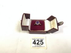 375 GOLD RING WITH A CENTRAL LARGE AMETHYST SURROUNDED WITH DIAMONDS SIZE T