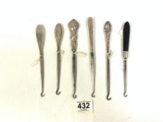 ANTIQUE SILVER AND EBONY BUTTON HOOKS VARIOUS DECORATION ON THE HANDLES