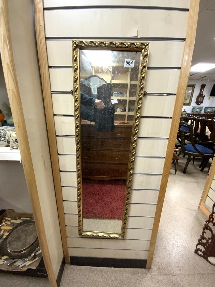 A GILT FRAMED RECTANGULAR WALL MIRROR. 30X104.