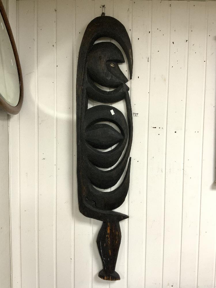 A CARVED TRIBAL WOODEN WALL MOUNT, 140 CMS.