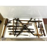 A QUANTITY OF TRIBAL SPEARS, KNIVES AND IMPLEMENTS.