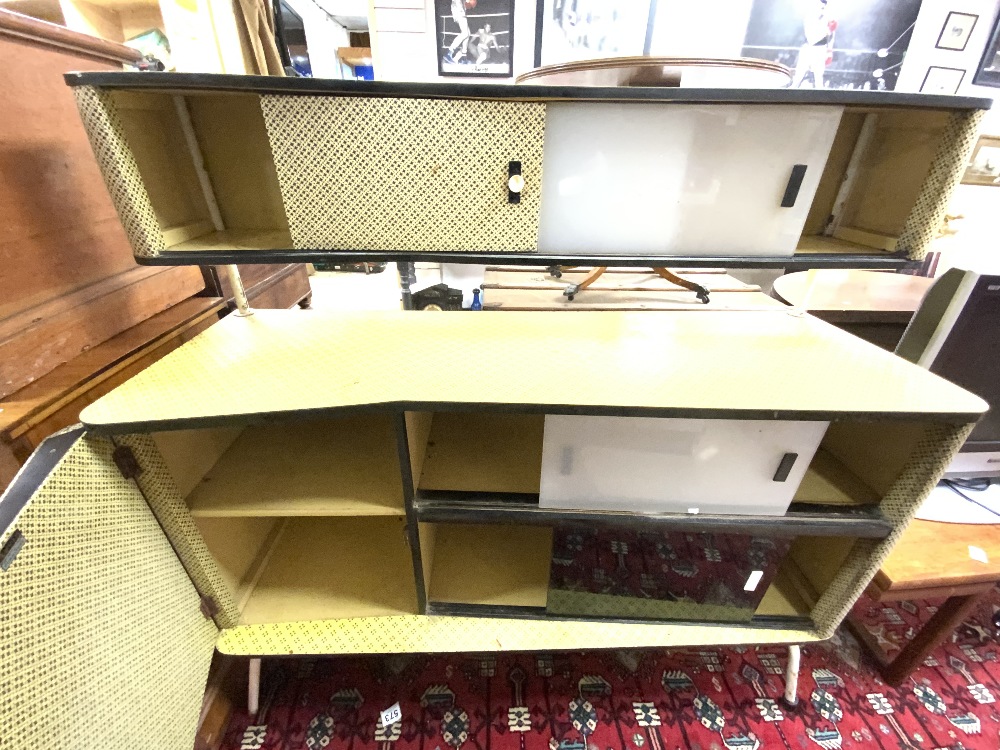 A 1950s/1960s YELLOW AND BLACK MELAMINE SIDEBOARD WITH SLIDING GLASS DOORS AND TWO CUPBOARDS. - Image 2 of 2