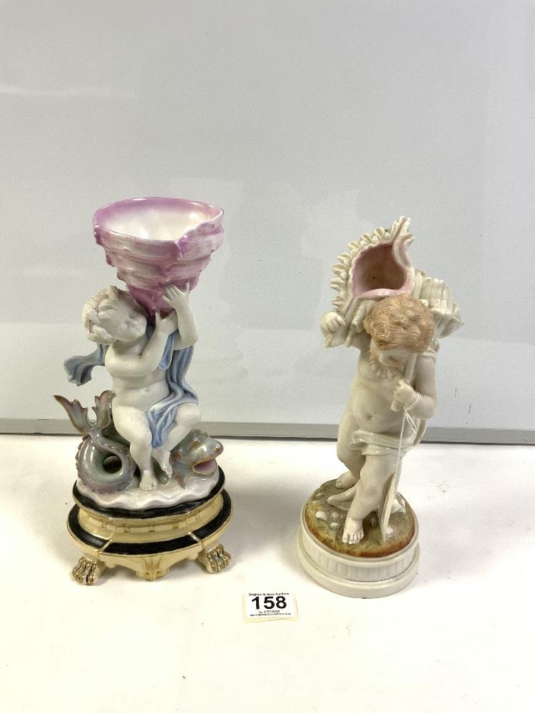 A PARIS PORCELAIN CHERUB SITTING ON SERPENT VASE A/F,30 CMS AND A PORCELAIN FIGURE OF A BOY CARRYING