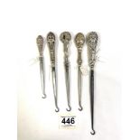 FIVE HALLMARKED SILVER BUTTON HOOKS WITH DECORATIVE HANDLES