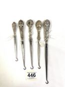 FIVE HALLMARKED SILVER BUTTON HOOKS WITH DECORATIVE HANDLES